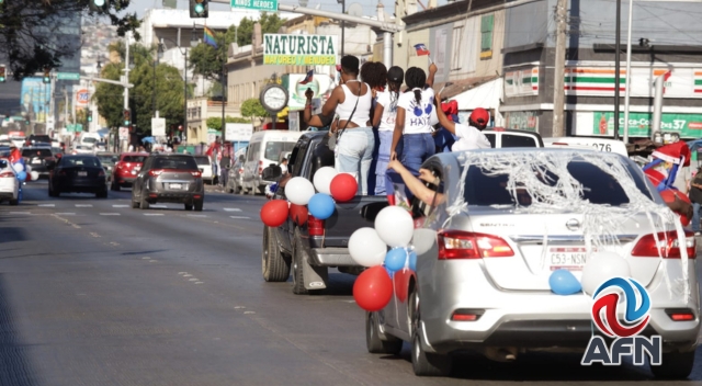 Haitianos realizan caravana en Tijuana previo al partido de su selección en el Mundial